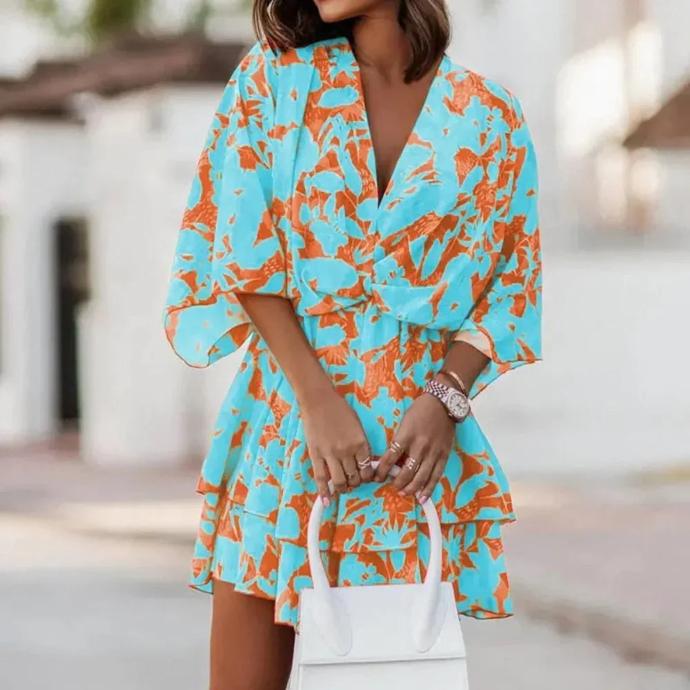 Sofie – Robe élégante avec jupe superposée et col en V