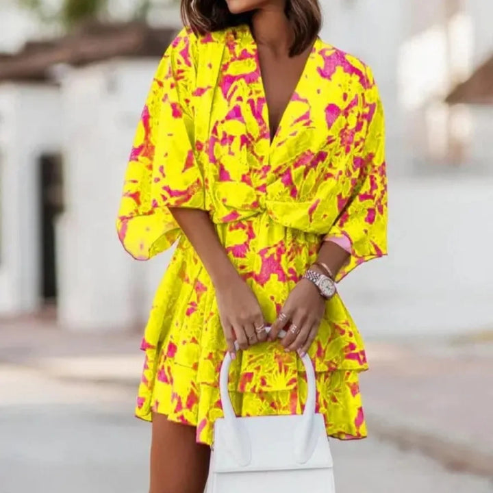 Sofie – Robe élégante avec jupe superposée et col en V