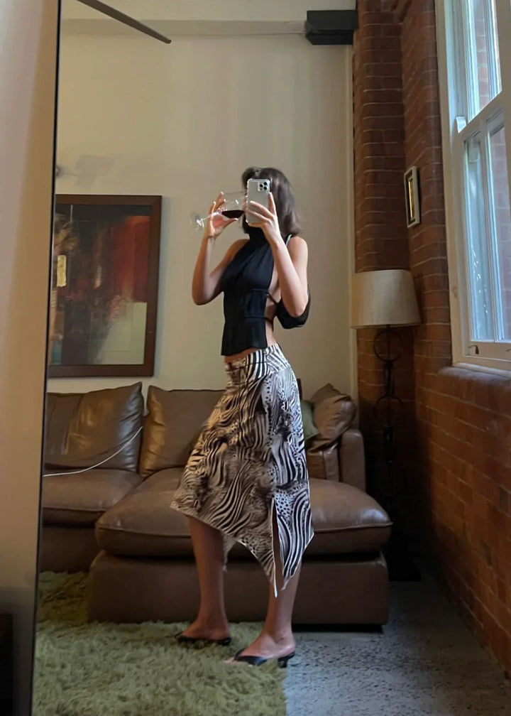 Olivienne – Geplisseerde backless top met halssluiting